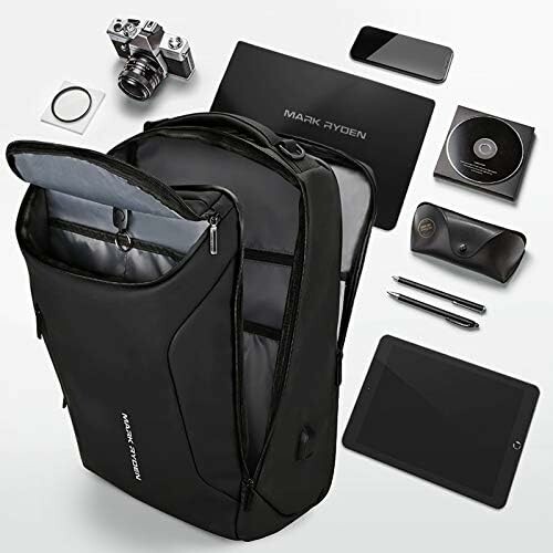 Black backpack with tech gadgets including a camera, tablet, smartphone, and accessories.